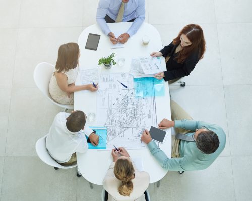 Theyre a dedicated group. High angle shot of a group of businesspeople meeting in the office